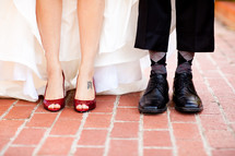 Close up of bride and groom's wedding shoes