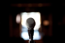 close up of microphone on stage in church building