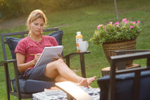 a woman studying outdoors 