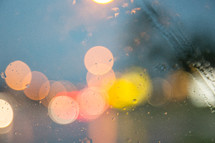 bokeh taillights on a rainy windshield 