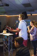 teens singing during a worship service 