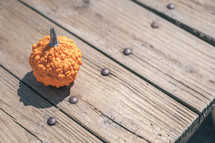 Small bumpy pumpkin on a table