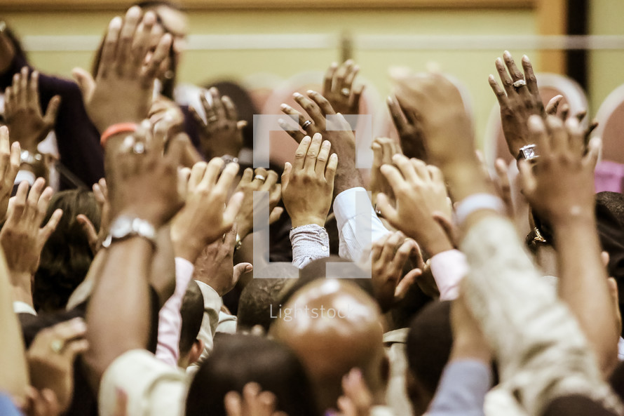 Raised hands at a worship service 