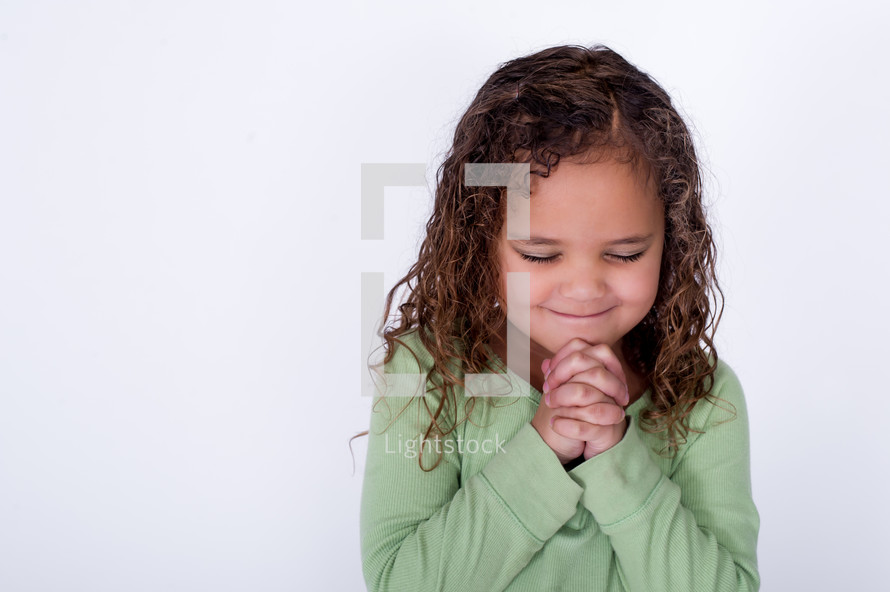 Happy girl praying.