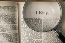 magnifying glass over Bible - 1 Kings 