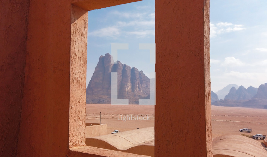 Seven Pillars of Wisdom seen from a window. Beautiful rock formation on entry in Wadi Rum.