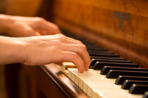 playing on a wood piano