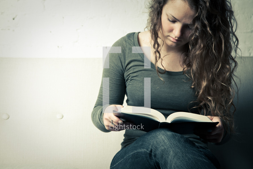 teen girl reading BIble