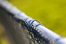 top of a chain link fence 