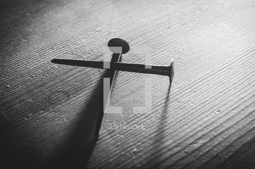 A b&w shot of two old nails forming a cross