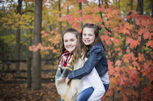 sisters outdoors in fall 