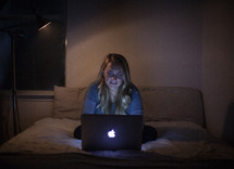 young woman on the internet in her dorm room 