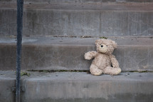 Lost Teddy Bear on a Step