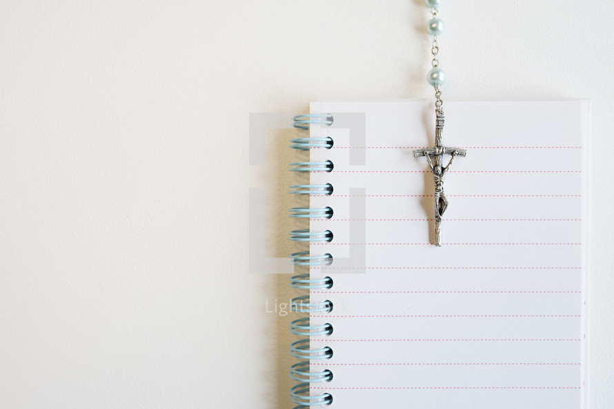 rosary on a notepad 
