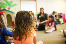 children listening in a classroom 