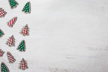Christmas tree cutouts on white 