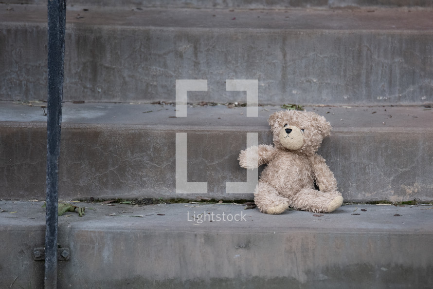 Lost Teddy Bear on a Step