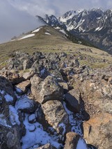 snow on rocks on a mountaintop 