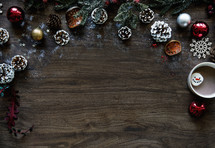 Christmas decorations border on a wood background 
