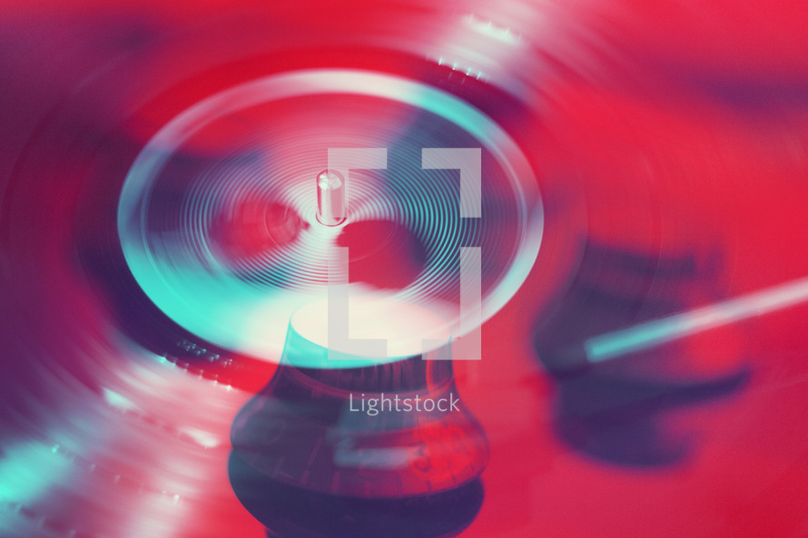 Pop Art Double Exposure Photograph of Vinyl Record Spinning and Electric Guitar Knobs