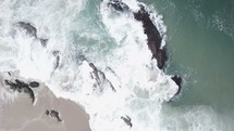 aerial view over waves in the ocean 
