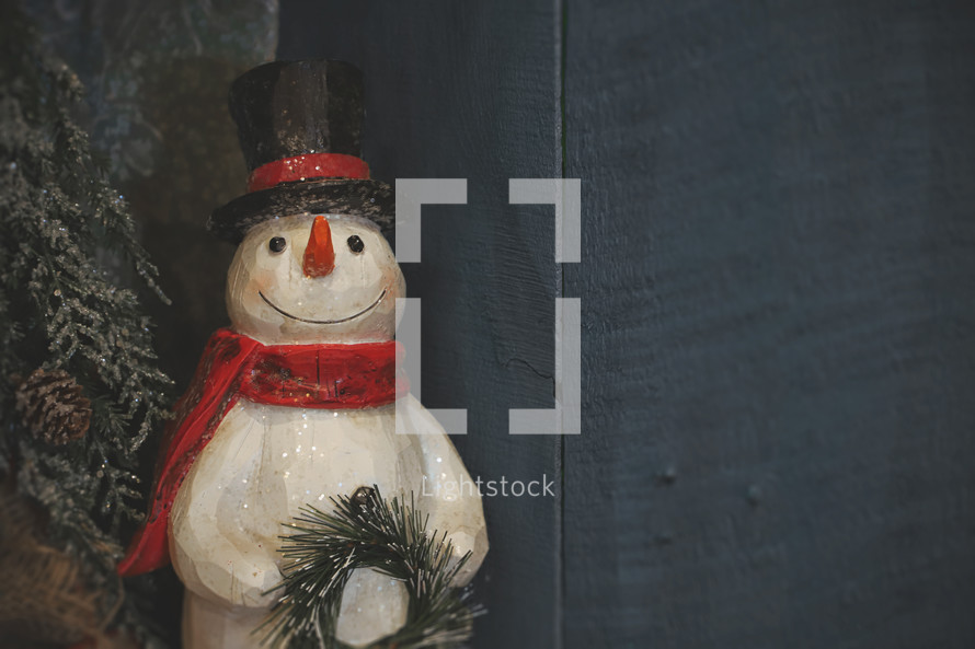 Christmas winter frozen snowman holiday decoration stock photo for a presentation background or social media post idea