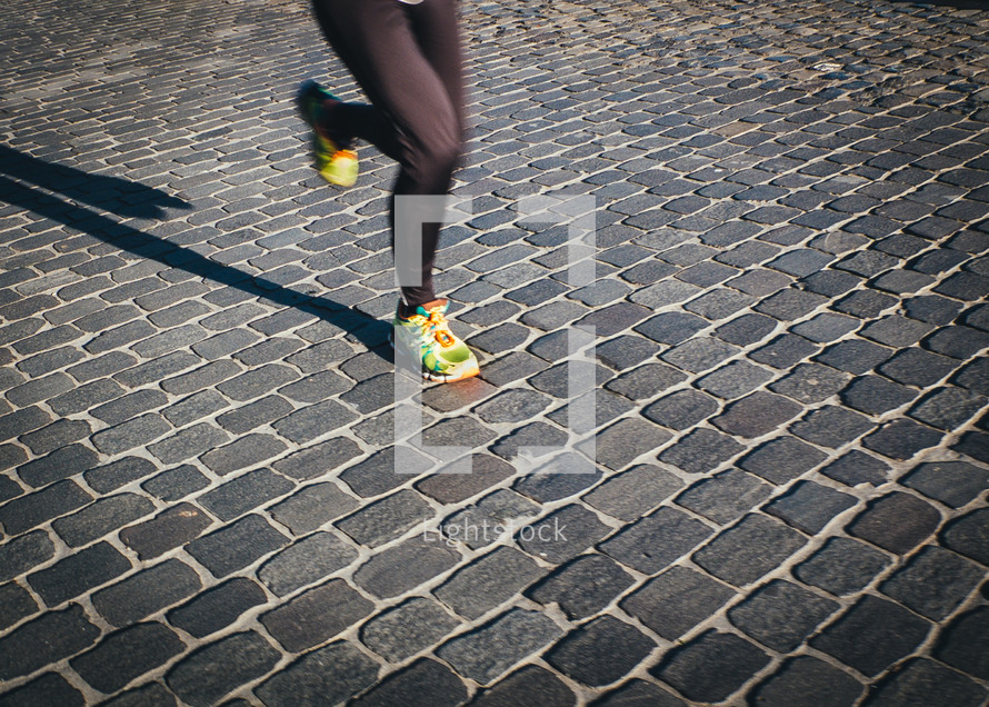 legs of a woman running 