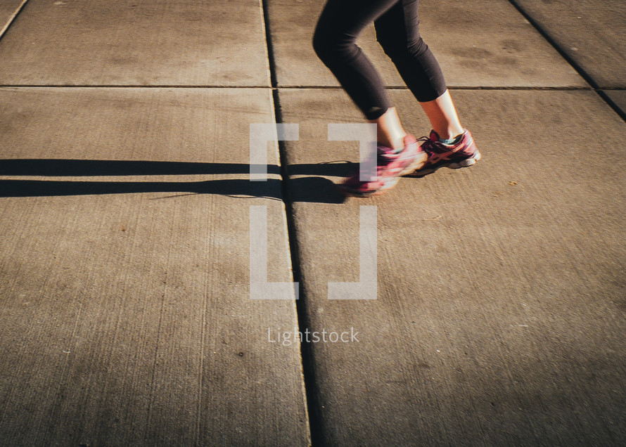 legs of a woman running 