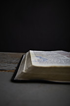 An open Bible laying on the table