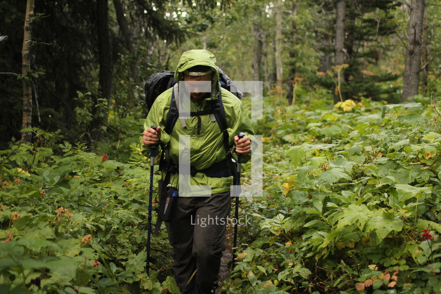 a man hiking through the woods 