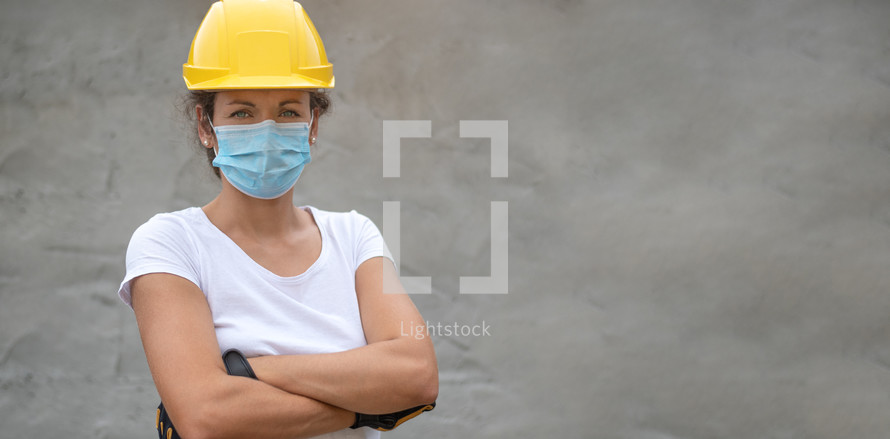 Woman work power. Portrait of female worker with face mask and US flag. Authentic close-up shot. Labor day.