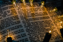 Christmas lights on page of a Bible