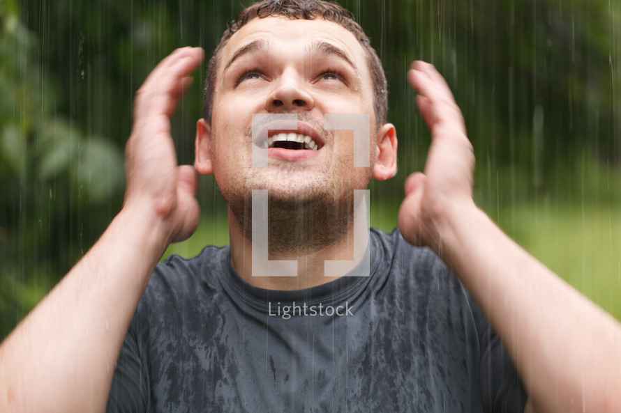 Young man under the rain