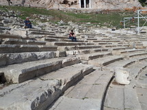 people visiting a coliseum in Greece 