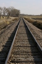 Long stretch of railroad tracks out in a wilderness area