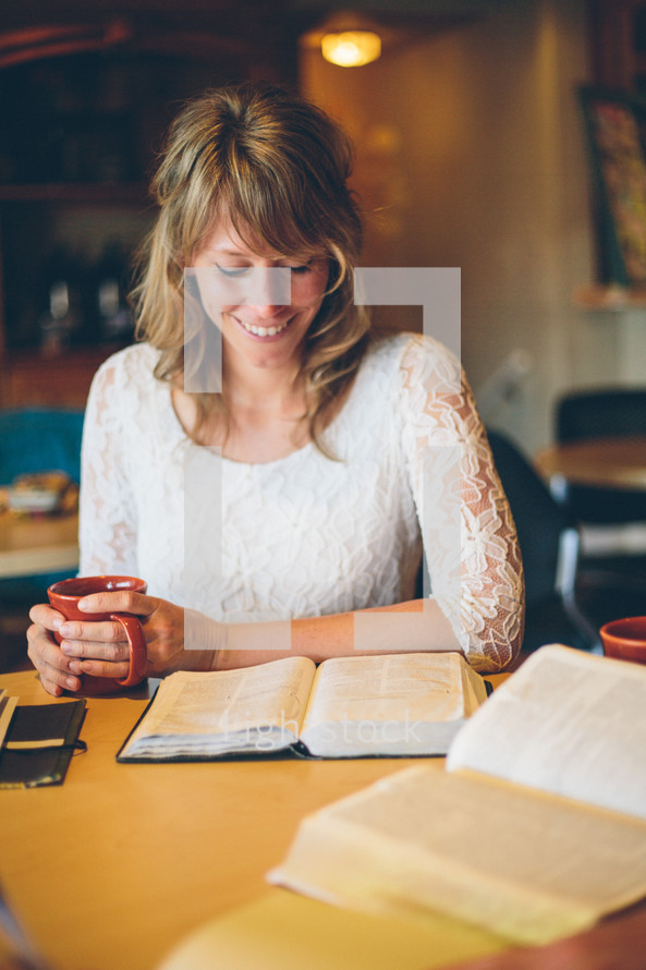 woman reading a Bible at a Bible study 