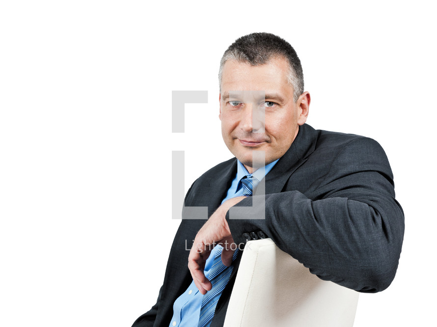 businessman sitting in a chair 