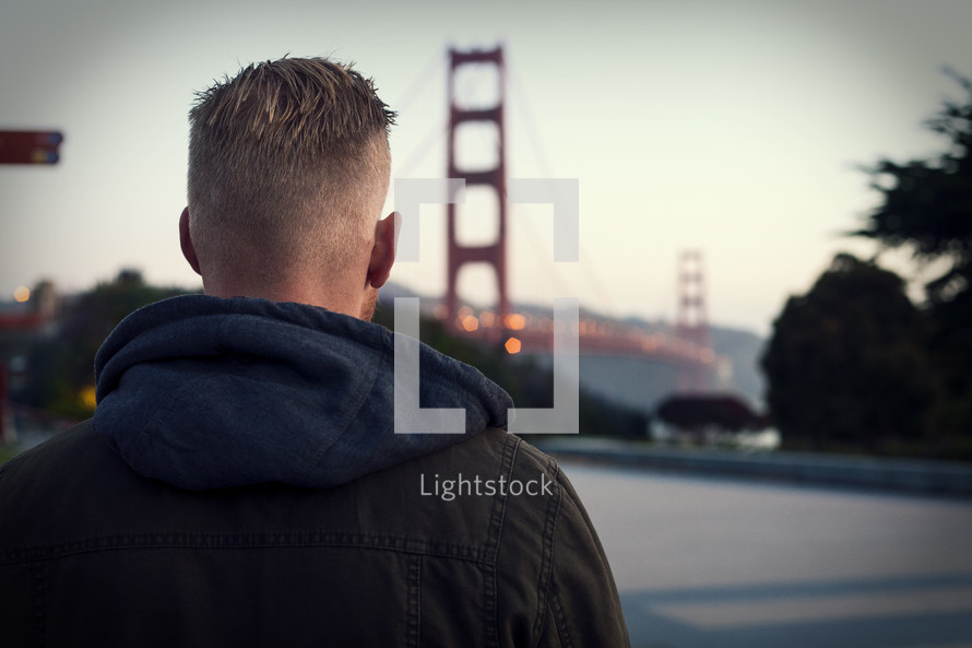 a man looking out at the Golden gate bridge 