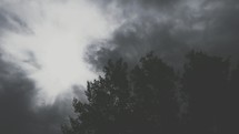 Light breaking through dark clouds