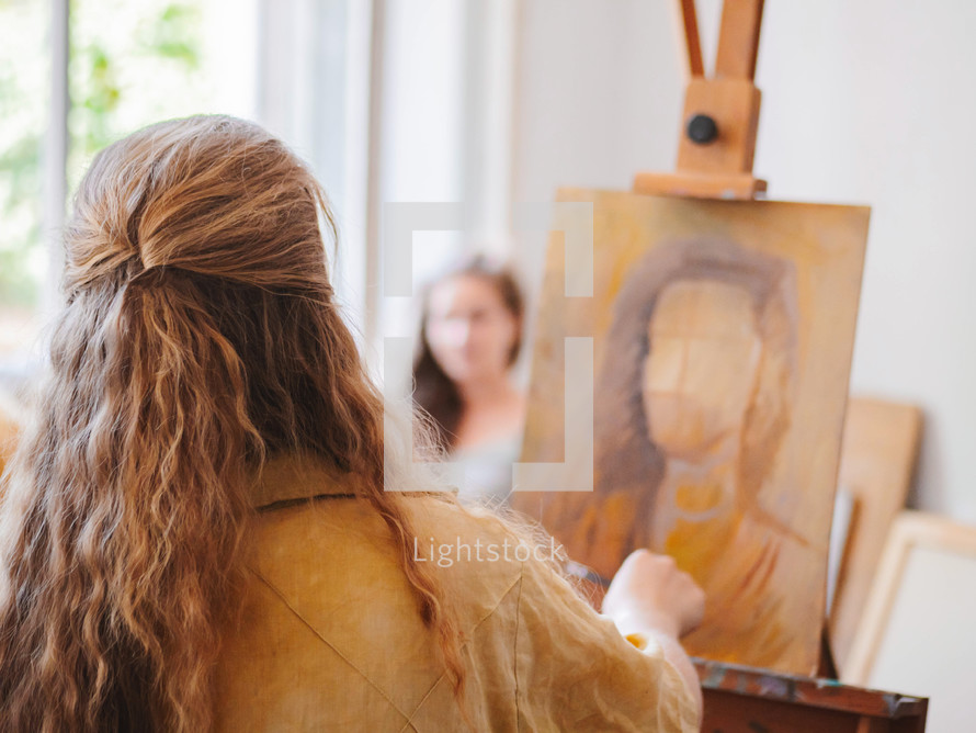 Woman Paints A Painting On Canvas. Art Academy Or Drawing School. Girl Paints