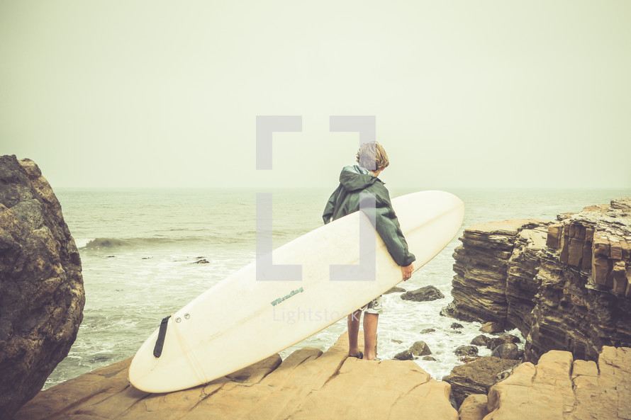 teen boy and a surf board 