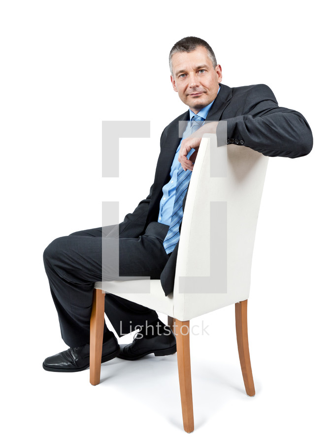 businessman sitting in a chiar 