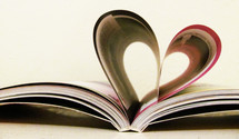 A book forms a heart with its pages.