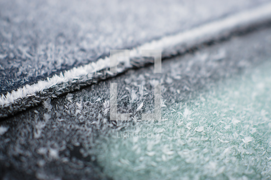 ice and snow on a car window 