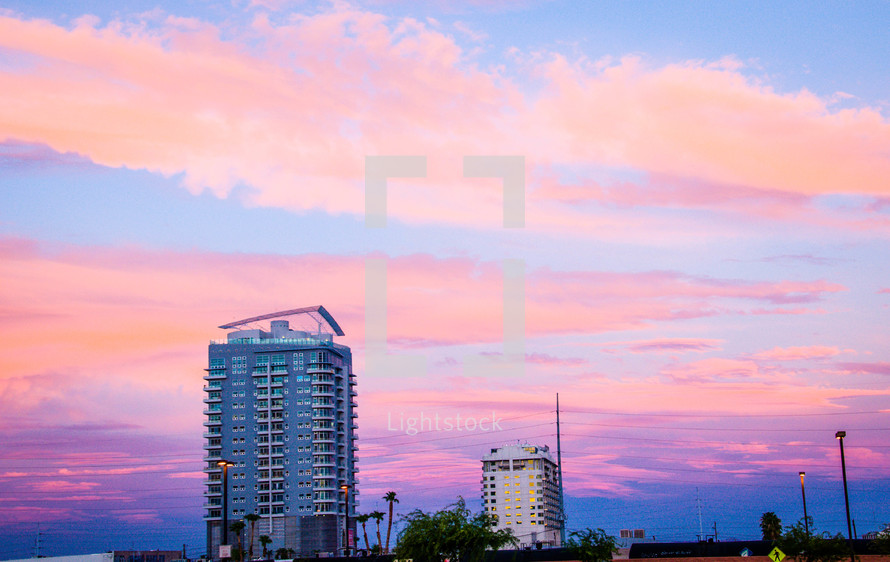 hotels under a pink sky at sunset 