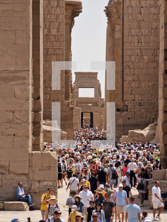 Luxor, Egypt - April 11, 2023: The opening hour at the Great Hypostyle Hall and clouds at the Temples of Karnak (ancient Thebes). Luxor, Egypt