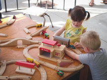 toddler's playing with a toy train 