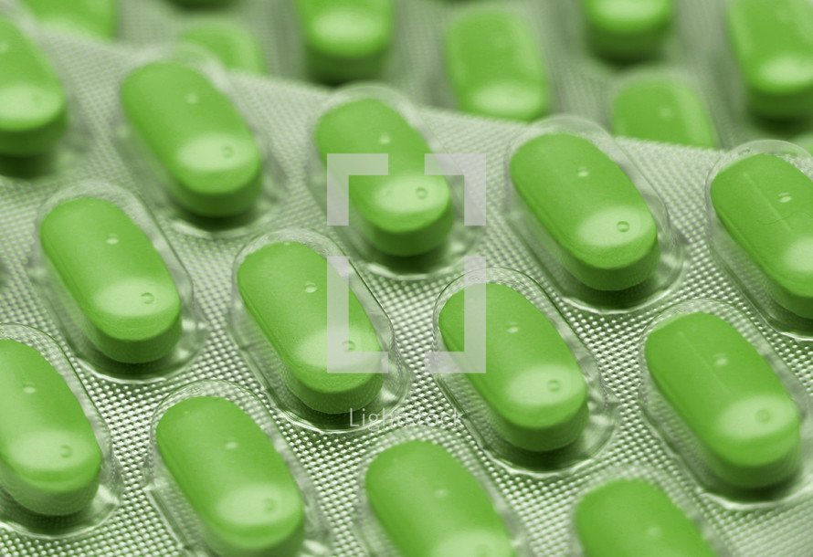 green pills in wrapper 