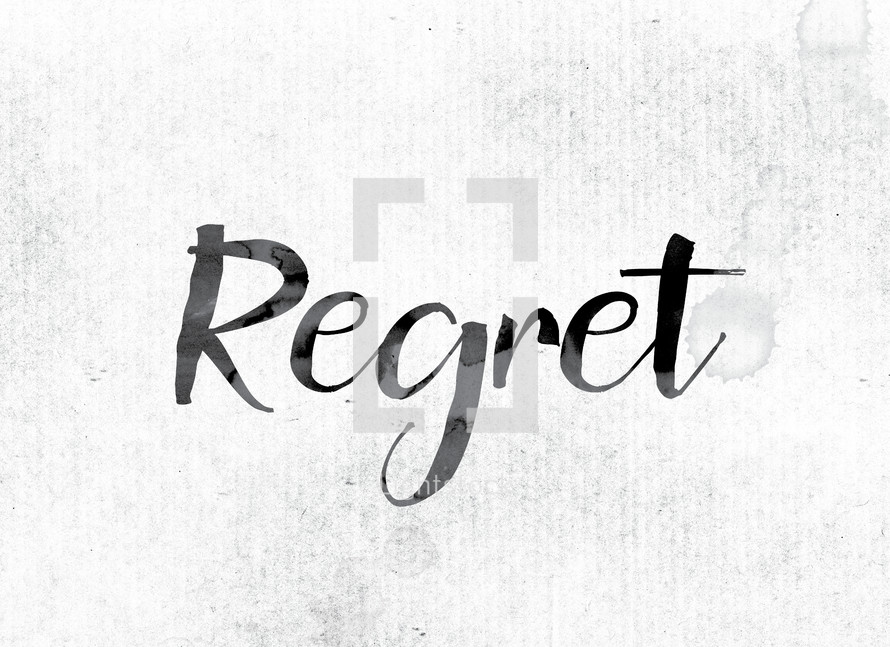 word regret in ink on white background 