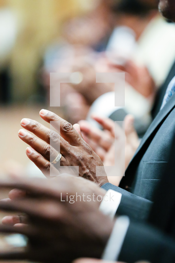 hands at a worship service 